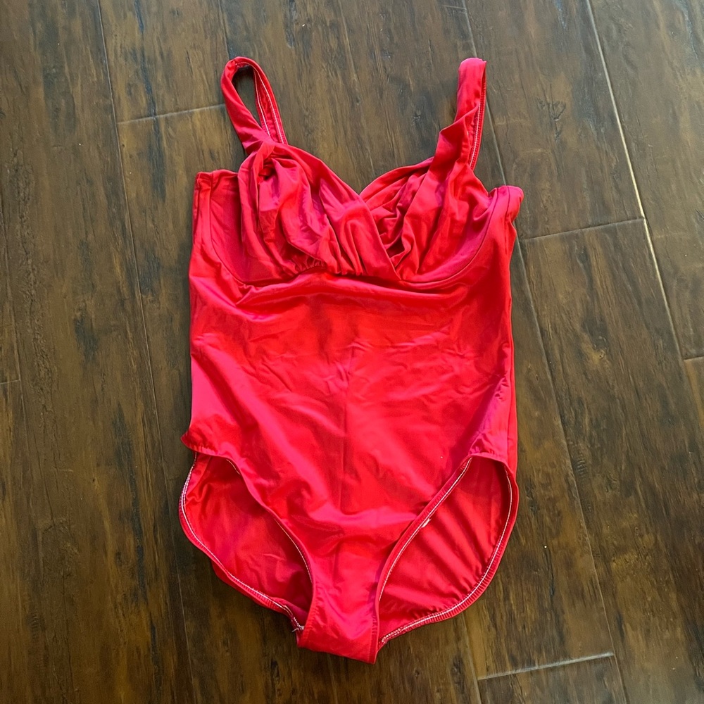 Magicsuit one-piece with red ruched detail.